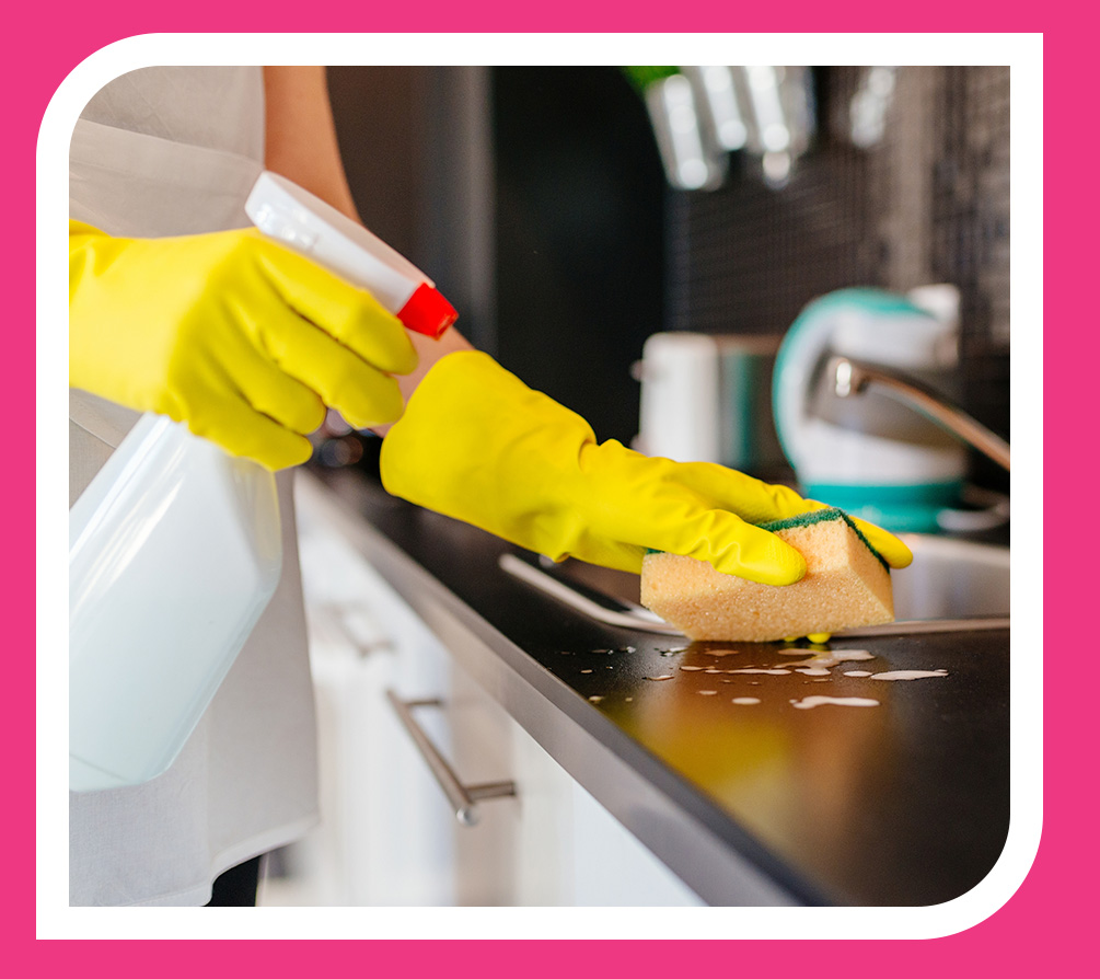 Person cleaning kitchen