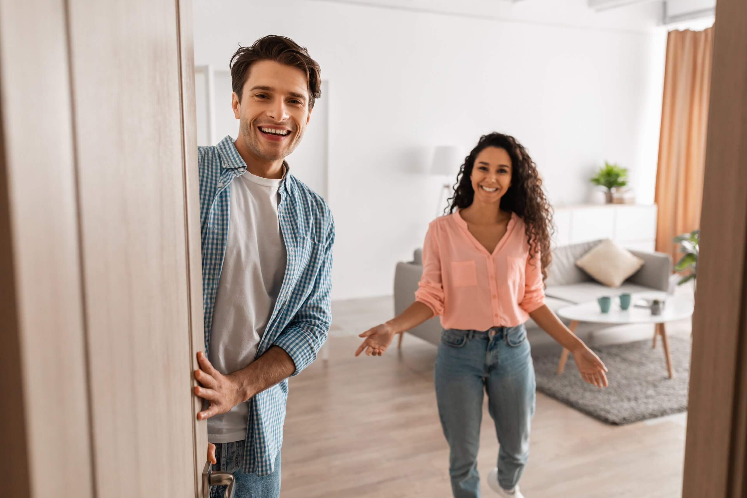 Portrait,Of,Cheerful,Couple,Welcoming,Inviting,Guests,To,Enter,Home, company cleaning